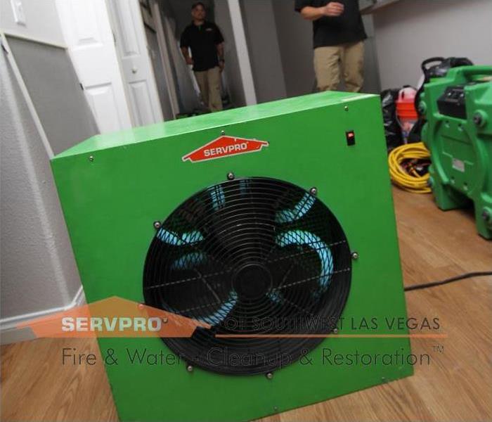 This is a green SERVPRO machine that removes odors from smoke after the house caught on fire.