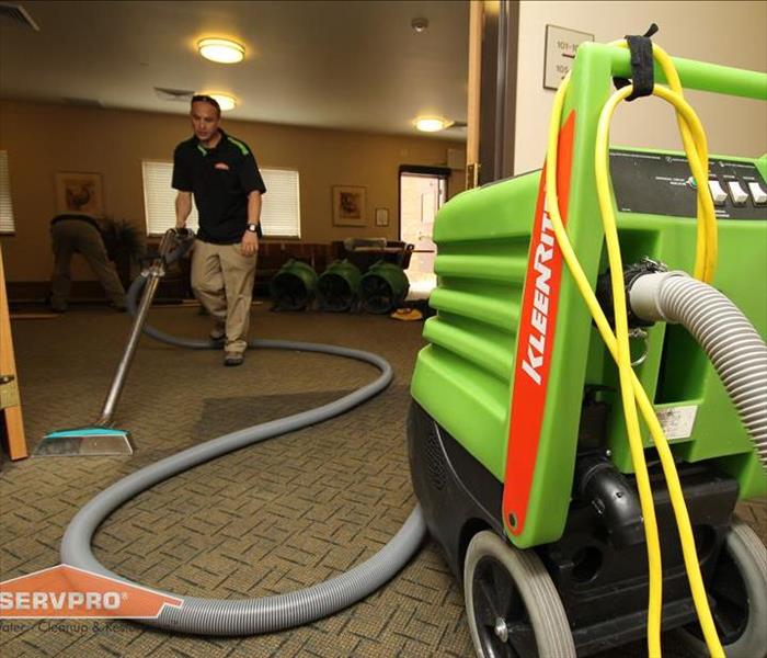 Our SERVPRO equipment used by a technician for extracting water from a carpet.
