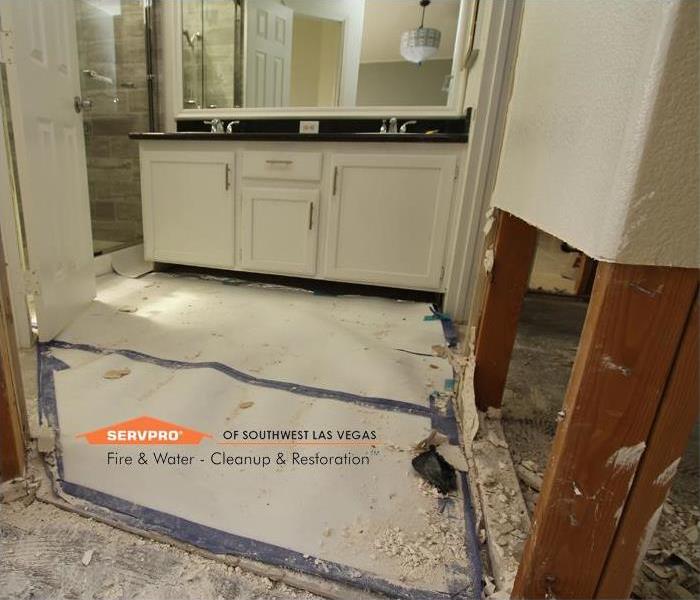 Protecting tile flooring from restoration debris.
