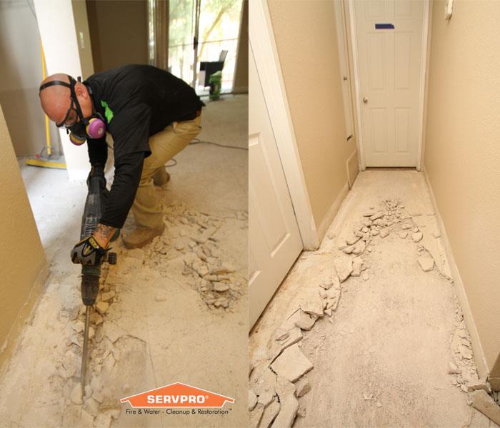 Our Water Damage Tech breaking up an old severely damaged concrete floor.